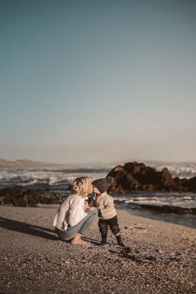 woman and toddler on beach travel cruise with a toddler and young kids